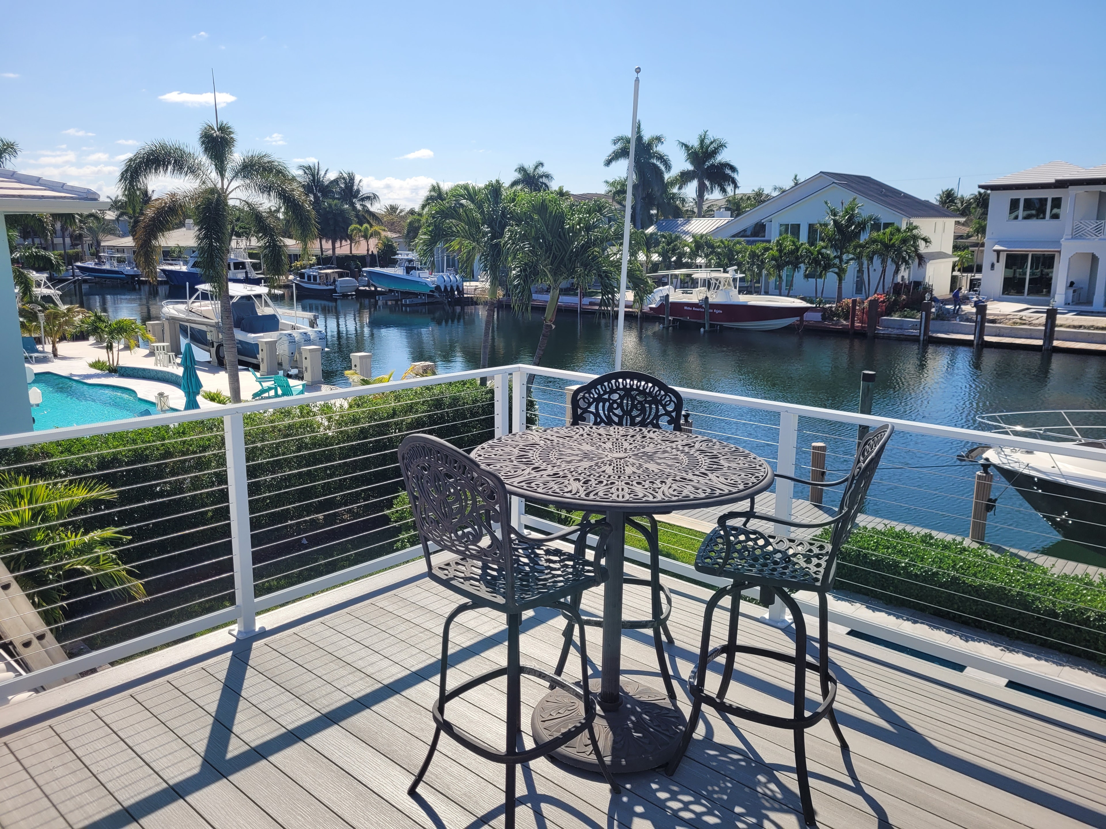 Luxury outdoor deck and pool area built by Deckmasters
