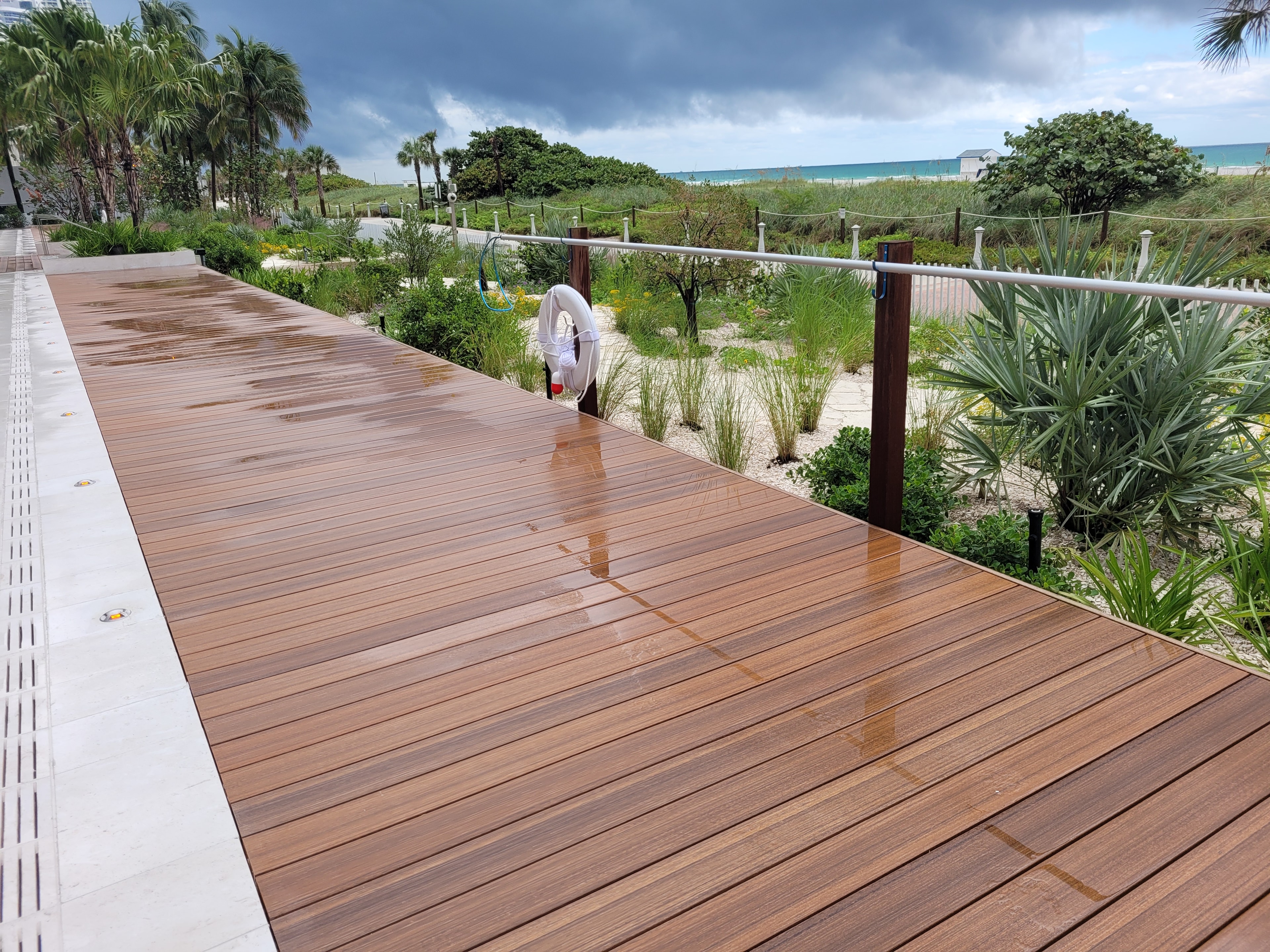 Single confirmed authentic upload. Descriptor: "wooden boardwalk leading to beach ocean"