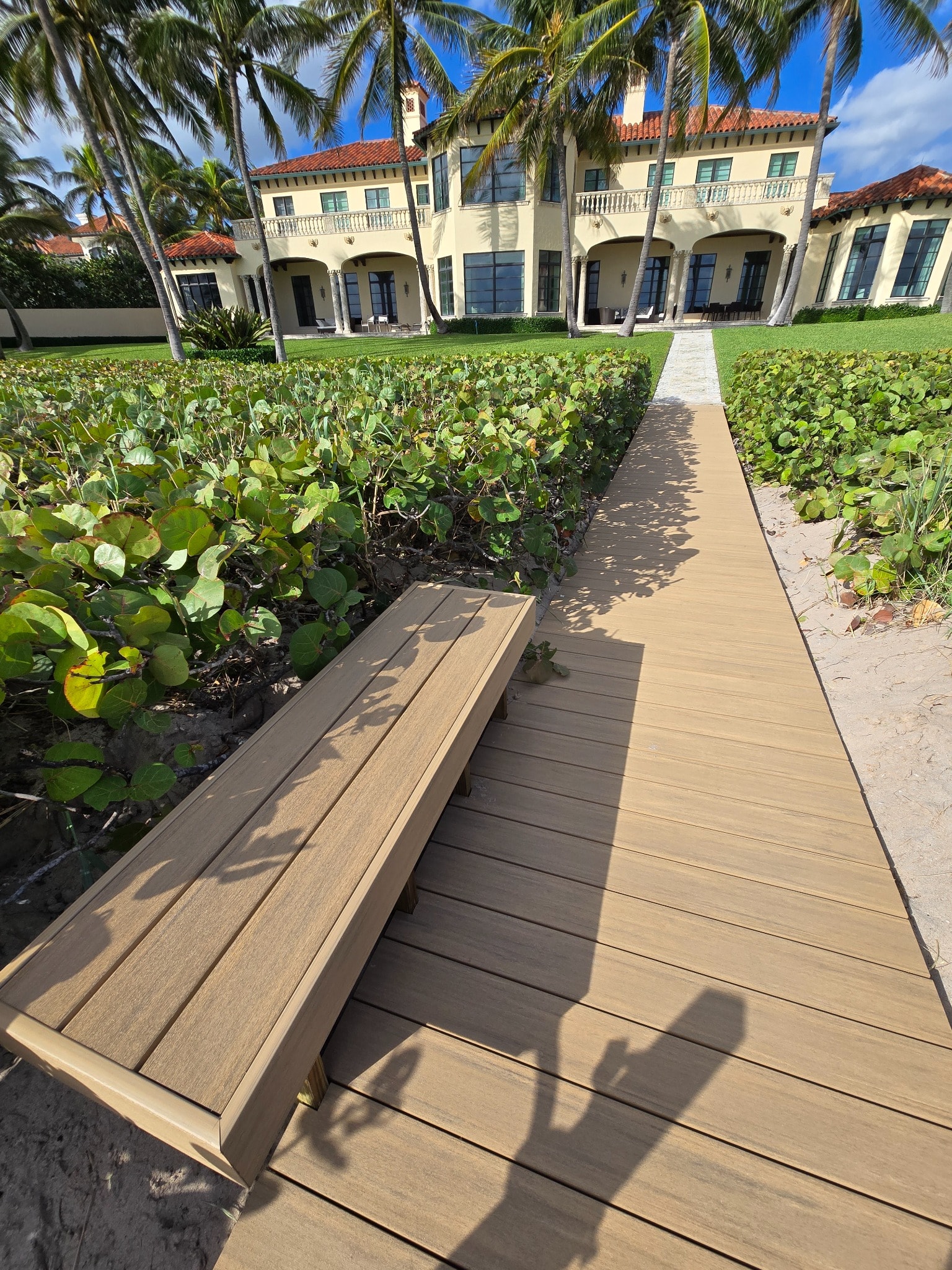 Weathered Teak — beachfront mansion boardwalk. ✅ OWNER: correct photo, too zoomed. FIXED: objectFit→contain.